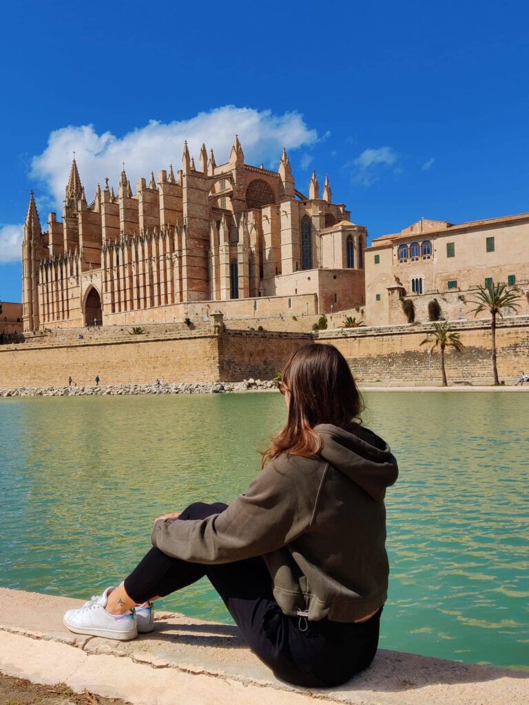 posing in front of the cathedral de mallorca